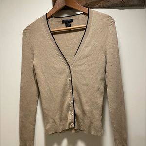 Limited tan cardigan with black detail.